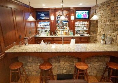 Beautiful wood and stone bar in remodeled basement