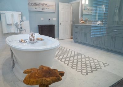remodeled master bath with larger soaker tub and tile floor inlay design